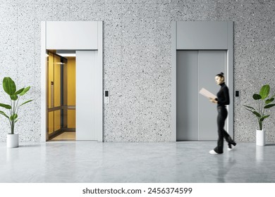 Woman brisk walking past modern elevator in office lobby, corporate hustle concept - Powered by Shutterstock