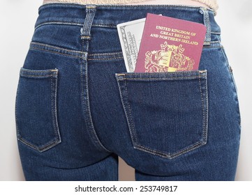 Woman With British Passport And Money In Back Pocket Of Her Jeans Ready For A Trip