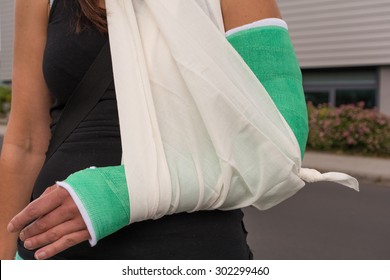 Woman With Broken Arm Supported