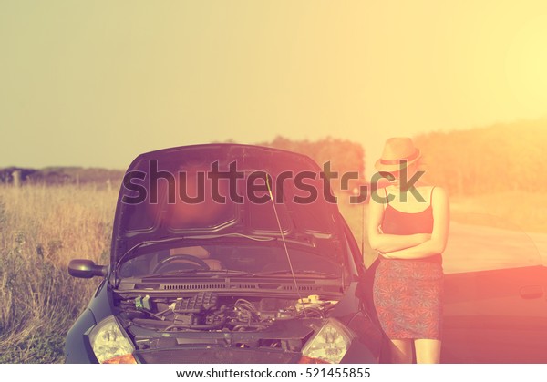 Woman with broken down\
car