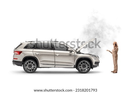 Woman with a broken down car calling a road service company isolated on white background



