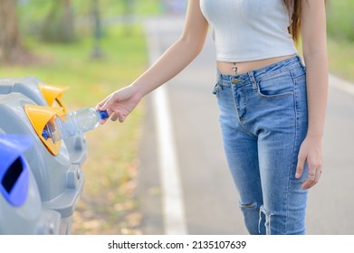 A Woman Brought The Plastic Water Bottle That Has Been Drained Of Water, Sorted Into Prepared Bins For Storage For Recycling