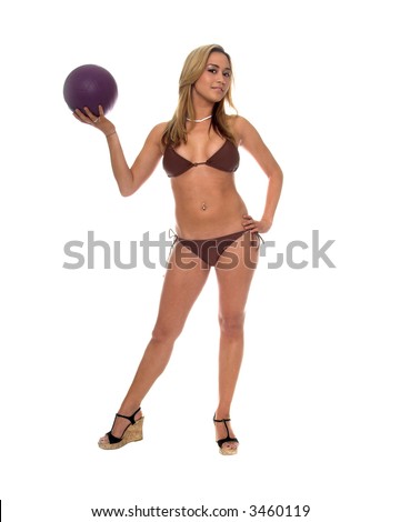 Woman in a brown bikini holding a purple volleyball Full body