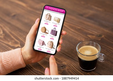 Woman Browsing Bags To Buy In Online Shop On Her Mobile Phone