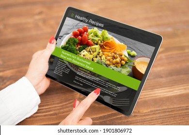 Woman browsing meal recipes on tablet