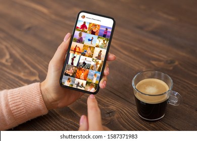 Woman browsing photos on social media app, person's name on screen is made up - Shutterstock ID 1587371983