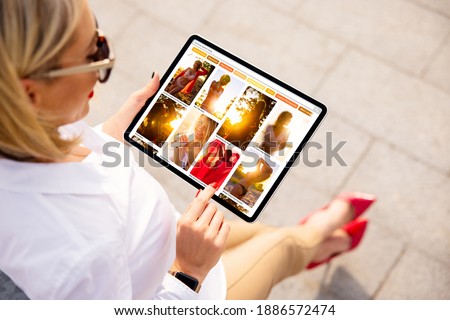 Woman browsing pinned photos online for ideas and inspiration on beautiful fashion photos.