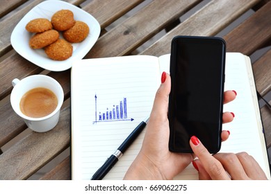 Woman browsing smartphone above