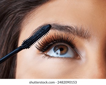 Woman, brush and mascara for eyelashes in studio with beauty makeup, growth and waterproof cosmetic as beautician. Girl, eyes and luxury product, serum and aesthetic for transformation at salon