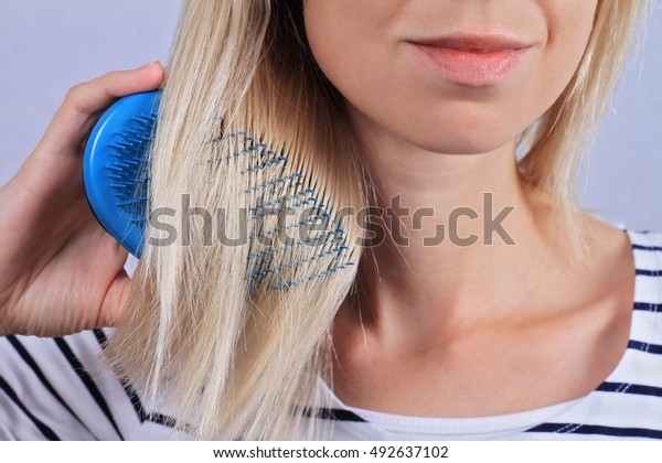 Woman Brushing Her Hair Thin Damaged Stock Photo Edit Now 492637102