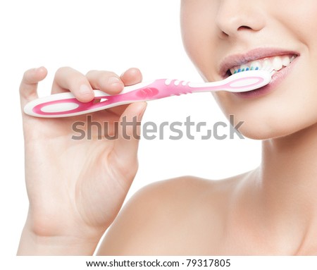 woman brushing her teeth  on white