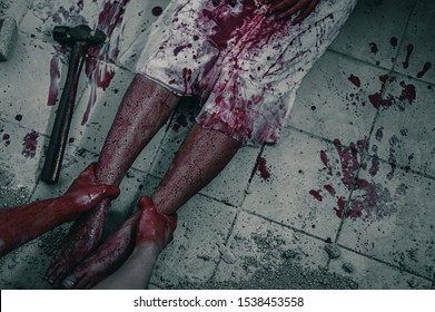 The woman was brutally being arrested and tortured in the leg. Women torture and need help, Halloween murder concept.