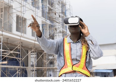 Woman builder construction using virtual reality headset at construction site. Foreman woman construction working and wearing virtual reality headset for inspecting work at construction site - Powered by Shutterstock