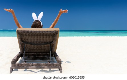 Woman With Bunny Ears On Sunbed At The Maldives