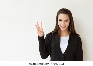 Woman Business Executive Showing 3 Or Three Fingers Hand Gesture