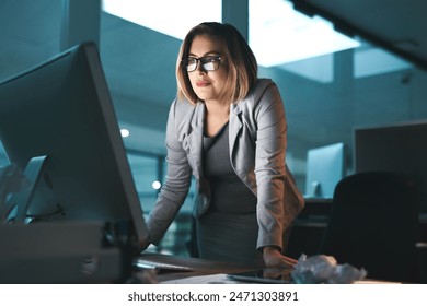 Woman, business and standing on computer in office for browsing internet, online and research for ideas. Female person, workplace and smile with deadline or overtime, project and reading as hr