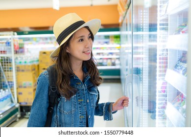 Woman buy something in convenient store  - Shutterstock ID 1550779448