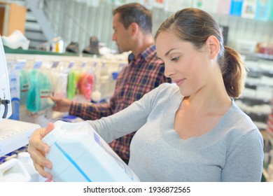 Woman Buyer Reading The Label