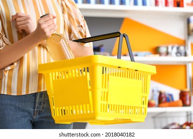 Woman Buying Alcohol In Supermarket