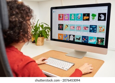 Woman buying NFT online on her desktop computer