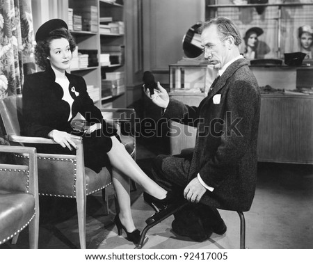 Woman buying shoes at a shoe store