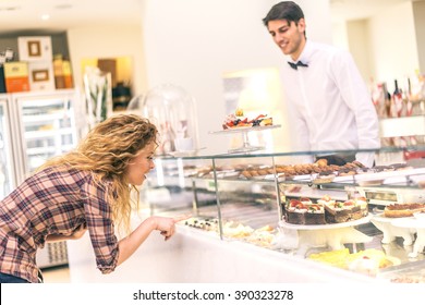 Woman Buying Some Cookies And Cakes In A Pastry Shop - Beautiful Girl  In Front Of Sweet Candy Food Store Window