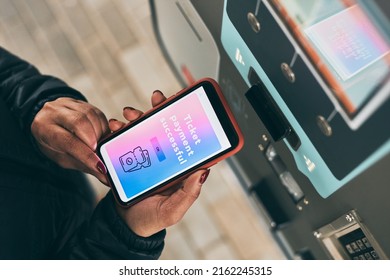 Woman buying ticket at ticket machine paying using mobile payment app on smartphone. Female buying bus public transpoort ticket in vending machine. Person purchasing car parking ticket using phone - Powered by Shutterstock