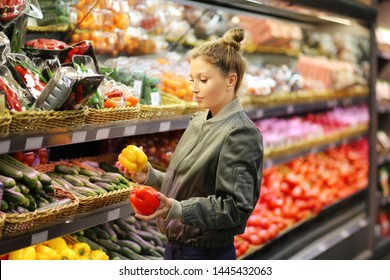 Woman Buying Vegetables At The Market