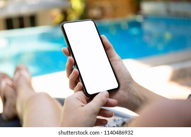 Woman By The Pool Holding Phone With An Isolated Screen