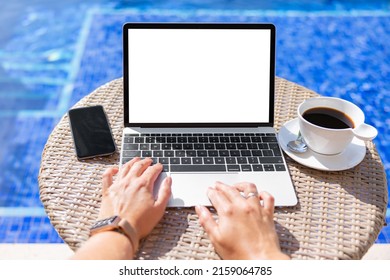 Woman by the pool working on laptop computer - Powered by Shutterstock