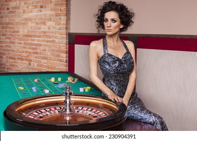 WOman By Roulette Table At Casino