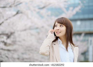 woman to call in the background of cherry tree