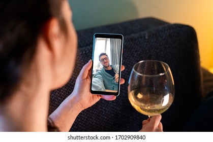 Woman Calling By Video Chat Her Friend And Drinking Wine With Him. Online Date, Meeting With Friend. Stay Home. Social Distance and Isolation - Powered by Shutterstock