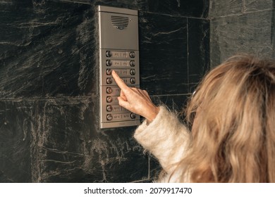 Woman Calling The Electronic Doorman Of The Portal