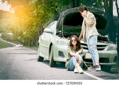 Woman calling for help after her car breakdown - Powered by Shutterstock