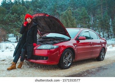 Woman Calling For Help With Broken Down Car At Winter Highway