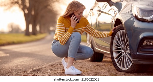 Woman Calling For Help On Phone After Car Breakdown On Country Road With Tyre Puncture - Powered by Shutterstock