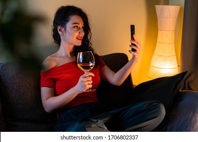 Woman Calling Her Friend By Video Chat And Drinking Wine. Online Date, Online Meeting With Friends. Stay Home. Social Distance, Isolation