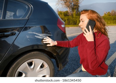 Woman calling insurance service after car crash