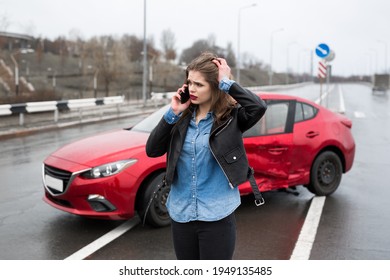 Woman Calls To A Service Standing By A Red Car