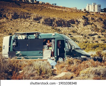 Woman In Camper Car. Camping On Sea Beach. Spanish Costa Blanca Coastline, Alicante Province, Santa Pola.