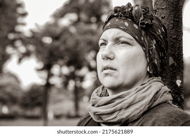 Woman With Cancer In Headscarf Outdoors.  Black And White Shoot