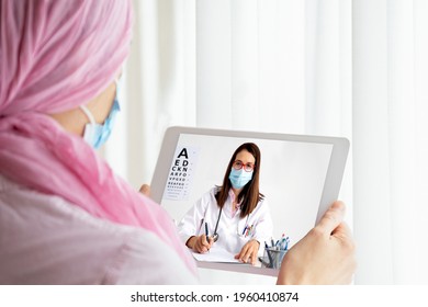 Woman With Cancer In An Online Consultation Through The Table. Female Doctor On Tablet Talking With Cancer Patient