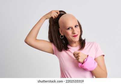 Woman With Cancer Taking Off Her Wig Showing Her Hairless Head