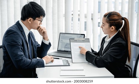 Woman Candidate Is Pointing On Her Resume And Explaining About Her Profile And Past Work Of Experience While Sitting To Job Interview With Man Employer In Office