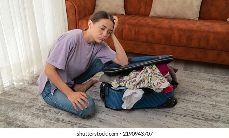 A Woman Cannot Close A Suitcase, Clothes Do Not Fit. High Quality Photo