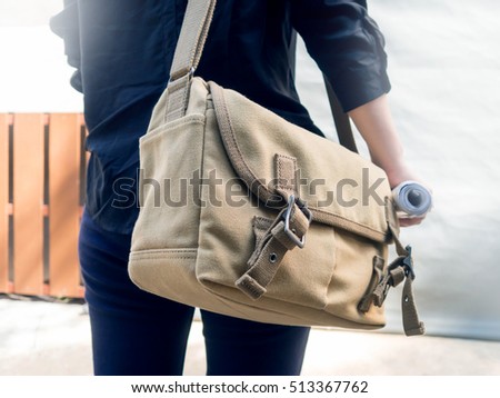 Woman with canvas shoulder bag.Concept of messenger,student,traveler