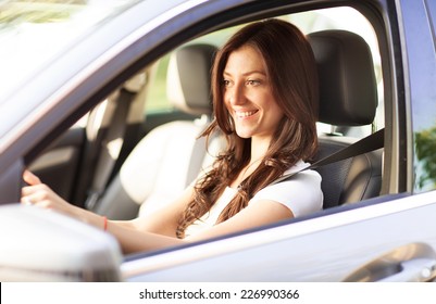 Woman in a car.  - Shutterstock ID 226990366
