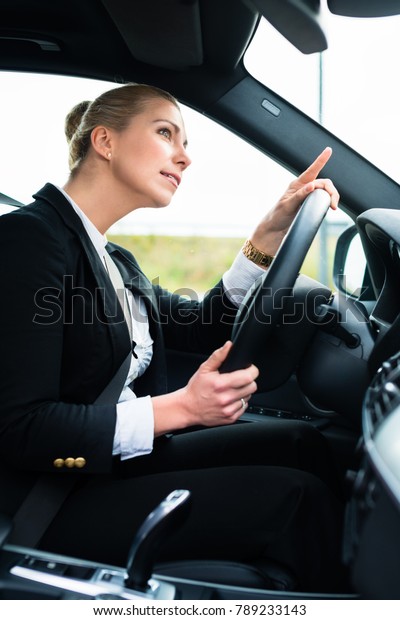 Woman in car\
being angry and cursing other\
driver