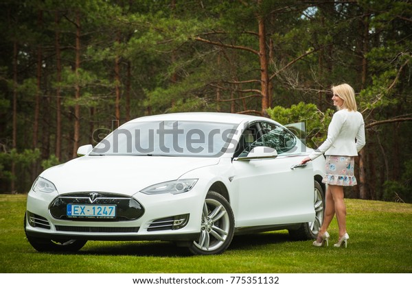 Woman and car or car and woman The future
car, Tesla Model S 90D and the owner of a young business woman.
/Description- Riga, Latvia, April 10, 2017 year
